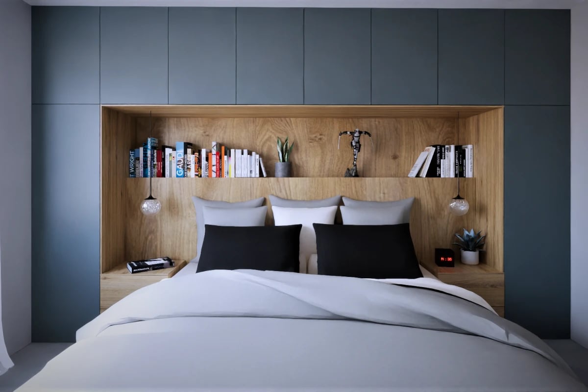 Mała sypialnia z łóżkiem oraz wykorzystaniem przestrzeni za łóżkiem na szafę. Szafa to połączenie koloru grafitowego oraz koloru drewna.