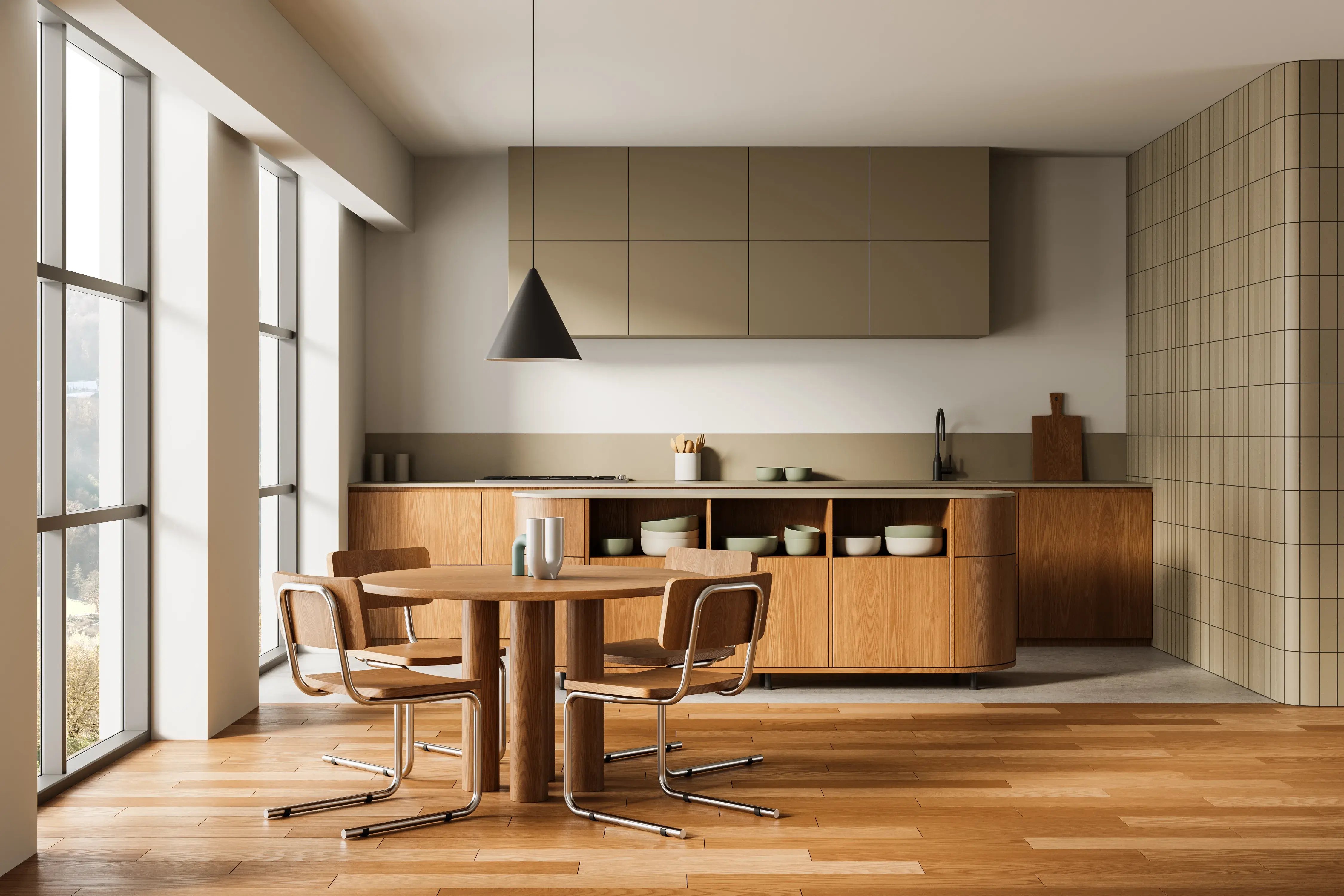 Jadalnia w stylu PRL z białymi ścianami, kuchnią połączoną z jadalnią, w kuchni wyspa oraz szafki dolne i blaty, a w jadalni drewniany okrągły stół z 4 krzesłami.