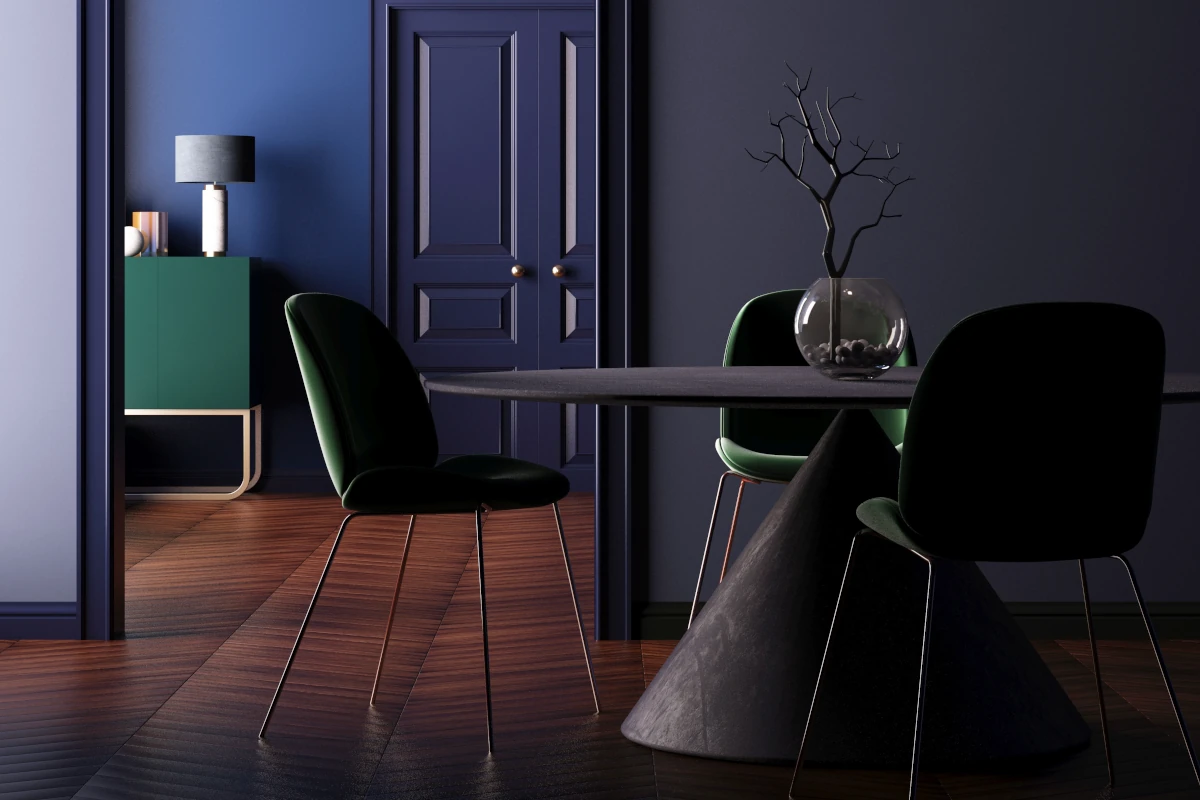 Stół o stożkowej podstawie wraz z trzema krzesłami z obiciem w koloru ciemnej zieleni. 